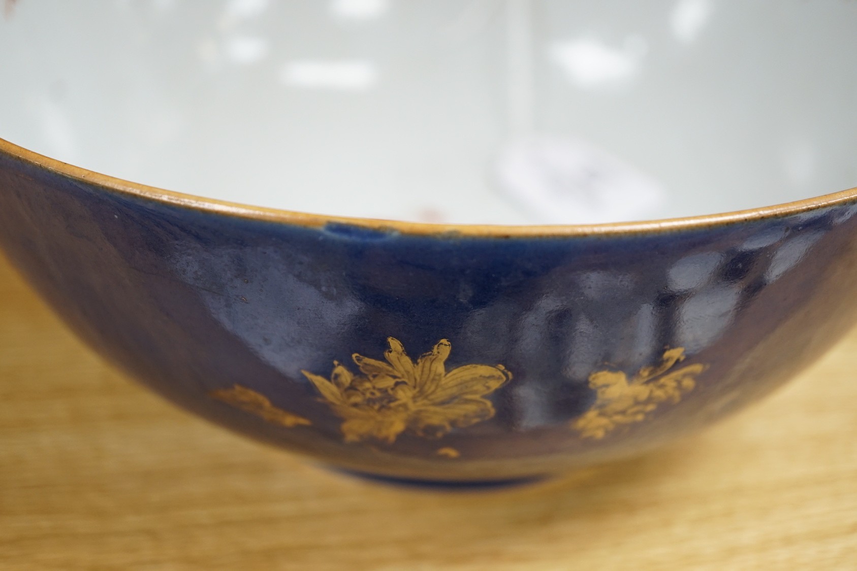 An 18th century Chinese gilt decorated powder blue glazed bowl, 26cm diameter